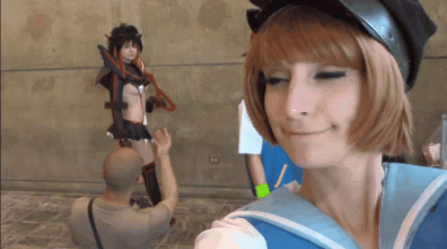 Man Taking Picture of Girl in Cosplay
