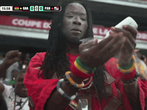 Man Taking Picture of Soccer Game Score 0-0
