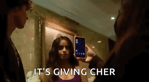 Man Taking Picture of Woman With It's Giving Cher
