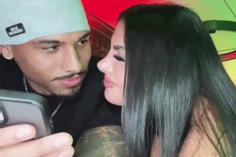 Man Taking Picture Of Woman With Phone GIF