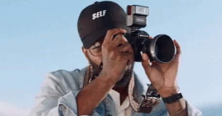 Man Taking Picture With Self Hat