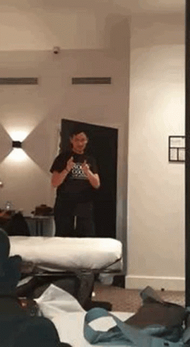 Man Taking Selfie In Hotel Mirror GIF
