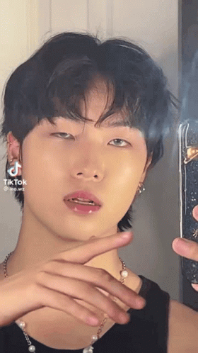 Man Taking Selfie in Mirror Wearing Pearl Necklace