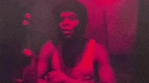 Man Taking Selfie in Mirror With Red Light