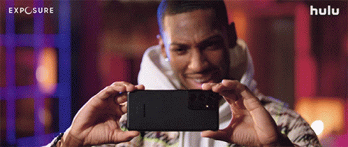 Man Taking Selfie With Exposure Text GIF