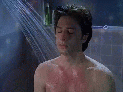 Man Taking Shower With Eyes Closed