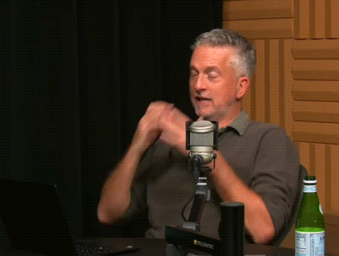 Man Talking Into Microphone