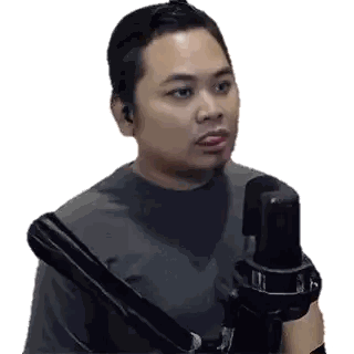 Man Talking Into Microphone
