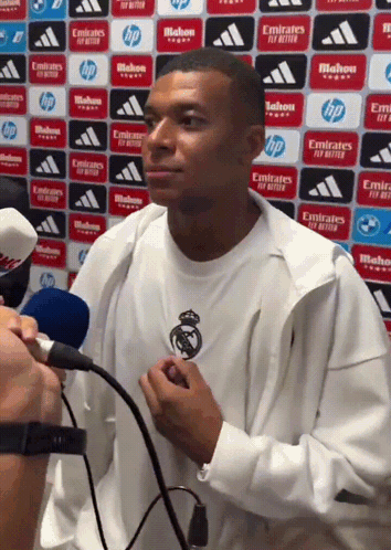 Man Talking Into Microphone Emirates Fly Better