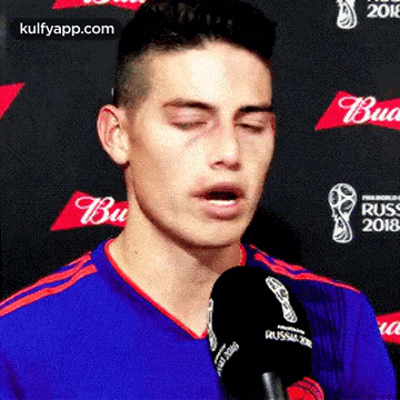 Man Talking Into Microphone Eyes Closed