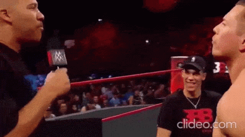 Man Talking Into Microphone in Wrestling Ring