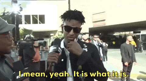 Man Talking Into Microphone Saying I Mean Yeah It Is What It Is