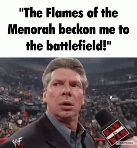 Man Talking Into Microphone Saying The Flames Of The Menorah Beckon Me To The Battlefield