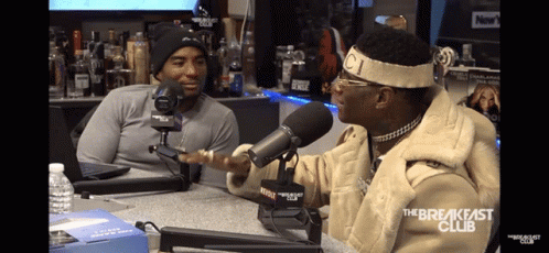 Man Talking Into Microphone With The Breakfast Club