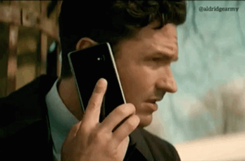 Man Talking On Cell Phone In Suit GIF