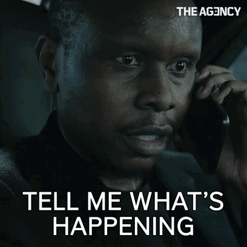 Man Talking on Cell Phone Saying Tell Me What's Happening