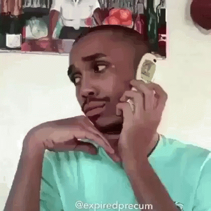 Man Talking on Cell Phone Sitting in Chair