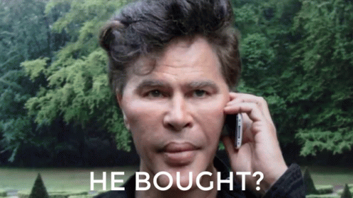 Man Talking on Cell Phone With He Bought