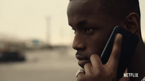 Man Talking on Cell Phone With Netflix