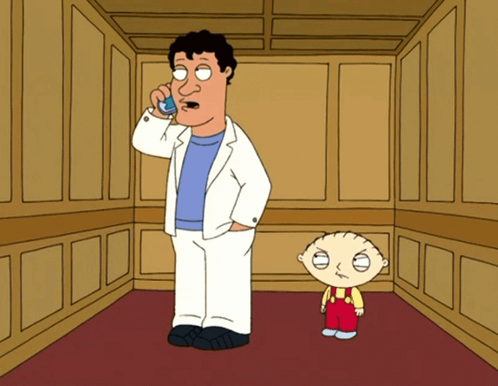 Man Talking on Cellphone Next to Boy