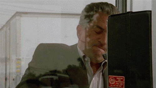 Man Talking on Phone With 24 Hour Emergency Button