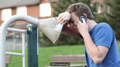 Man Talking on Phone With Cone Over Face