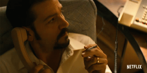 Man Talking On Phone With Netflix Logo GIF
