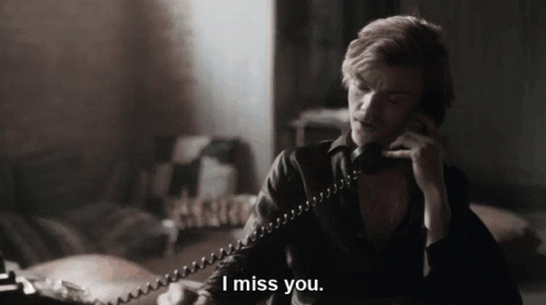 Man Talking on Telephone Saying I Miss You