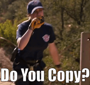 Man Talking on Walkie Talkie Saying Do You Copy