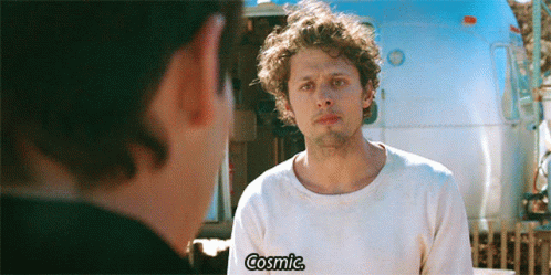 Man Talking to Another Man With Cosmic Shirt