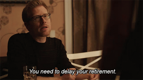 Man Talking to Another Saying You Need to Delay Your Retirement