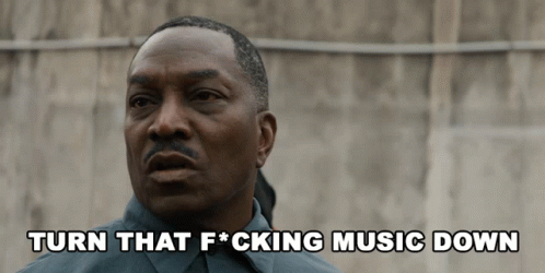 Man Telling Someone to Turn Music Down