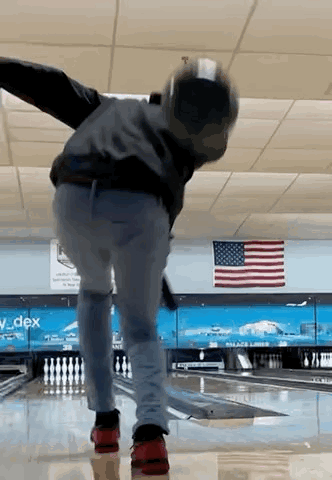 Man Throwing Bowling Ball with American Flag