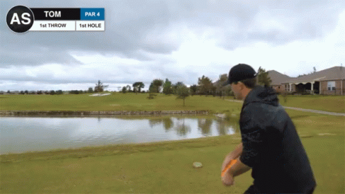 Man Throwing Frisbee on Golf Course Tom