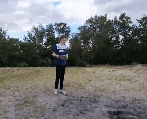 Man Throws Frisbee Far GIF