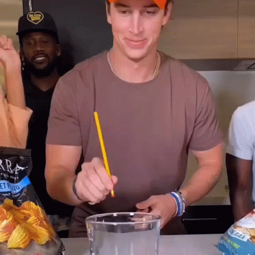 Man Throws Pencil In A Cup GIF