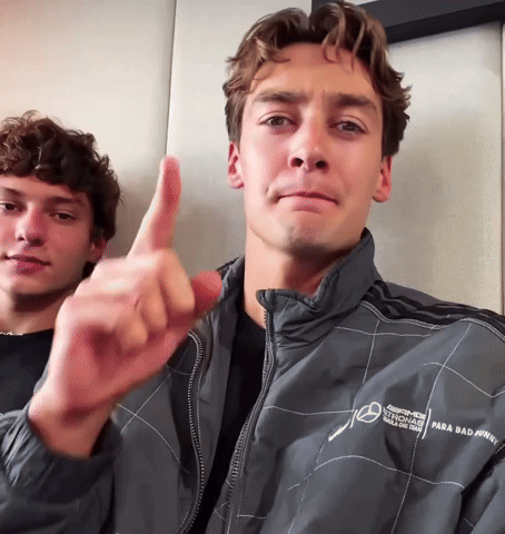 Man Thumbs Up Beside Man in AMG Jacket