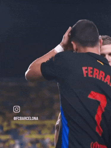 Man Thumbs Up Next to Man with FC Barcelona
