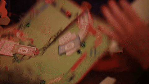 Man Tossing Monopoly Money And Board GIF