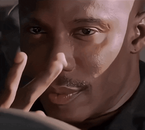Man Touching Nose