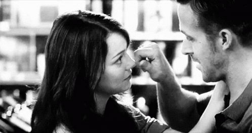 Man Touching Woman Nose With Fist