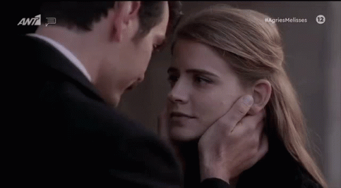 Man Touching Woman's Face