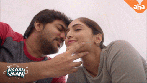 Man Touching Woman's Face With Akash Vaani Sticker GIF