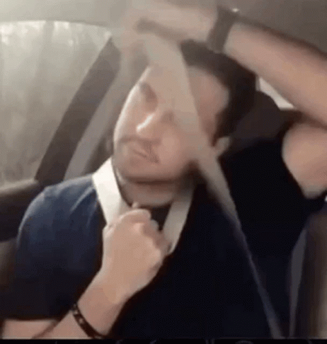 Man Tying Seat Belt In Car GIF