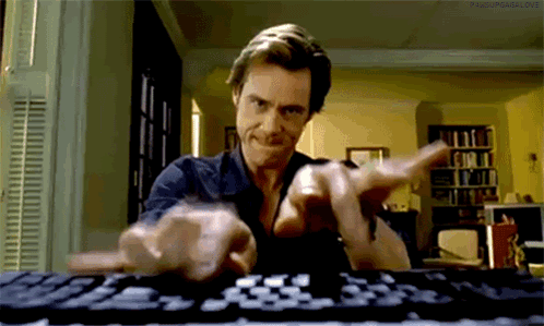Man Typing on Keyboard Making a Face