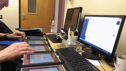 Man Using Computer With Microsoft Screen