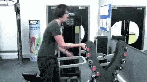 Man Using Gym Machine by Sign Saying New Improve Your Work