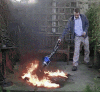Man Vacuumed A Small Fire Tornado GIF