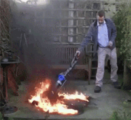 Man Vacuuming Fire GIF