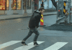 Man Walking Against Wind GIF